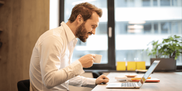 man using homecare agency software on his laptop