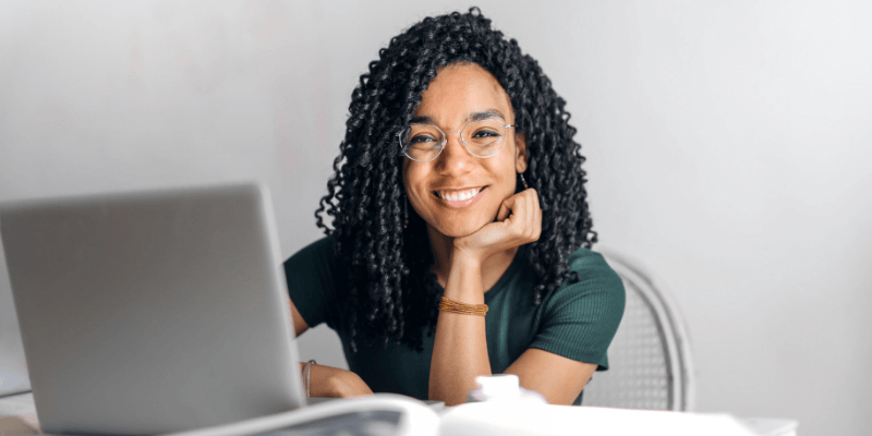 woman working at computer to start her homecare business